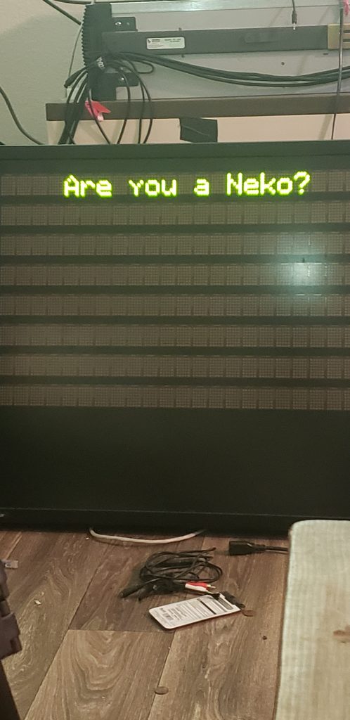 Led sign saying "are you a Neko?"